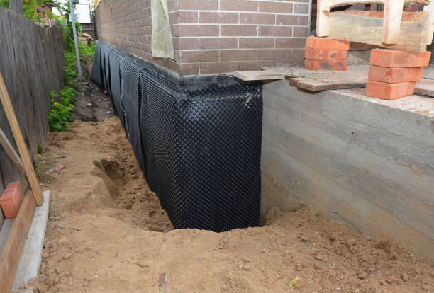 Happy homeowners after waterproofing job in Amesville